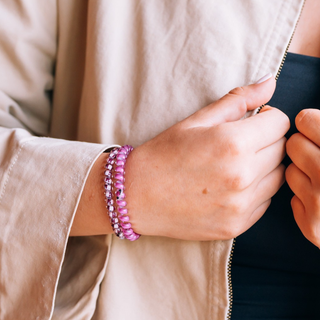 TELETIES small hair ties worn as bracelets on a wrist, styled with a casual outfit.