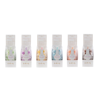 Six Bonblissity Sweet + Single moisturizing candy scrub packages displayed in a row on white background.