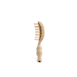 TELETIES Mini Vented Hair Brush with gold-tone base plate, cushioned bristles, and ergonomic curved handle.