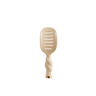 TELETIES Mini Vented Brush with twisted handle, wavy vented bristle design, and gold accent tip.
