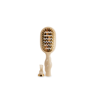 TELETIES mini vented hair brush with gold bristles and twisted handle, includes cleaning tool.