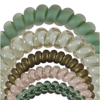 Five spiral coil hair ties arranged in an arch formation against a black background.