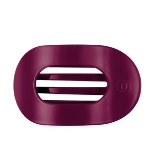 TELETIES large flat round hair clip with open oval design and textured side button.