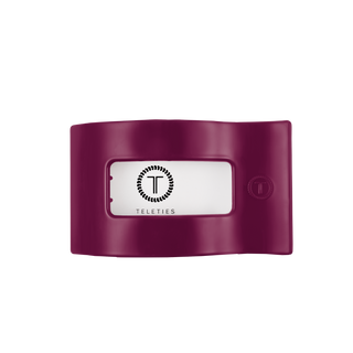 TELETIES flat rectangle hair clip with branded logo window and button closure on dark background