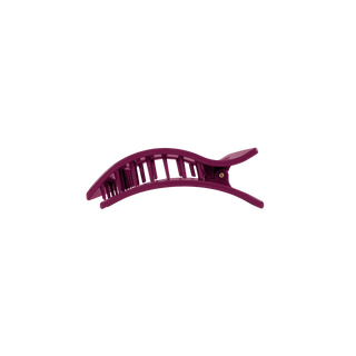 A sleek, curved rectangular hair clip with open lattice design and a small pivot hinge.