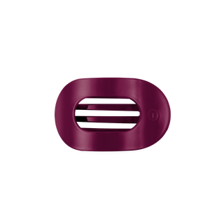 TELETIES small flat round hair clip with open oval design and grooved teeth detail.