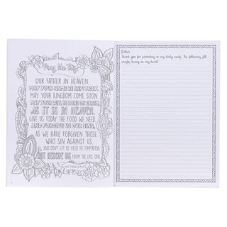 Open prayer journal showing decorated Lord's Prayer page and lined journaling page for reflection.