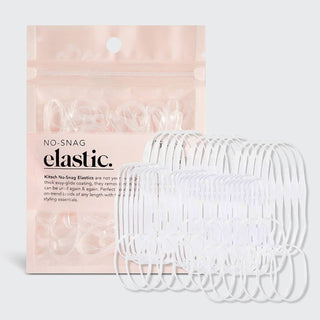 Clear no-snag elastic hair ties displayed next to pink packaging on white background.