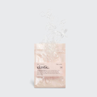 Package of KITSCH no-snag elastic hair ties in clear packaging on white background