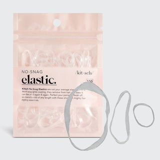 Clear no-snag elastic hair ties in packaging with product displayed alongside pink retail package.