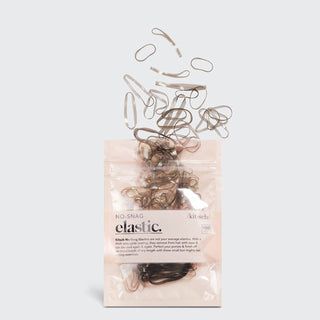 KITSCH No-Snag Elastic hair ties spilling from clear package against light background