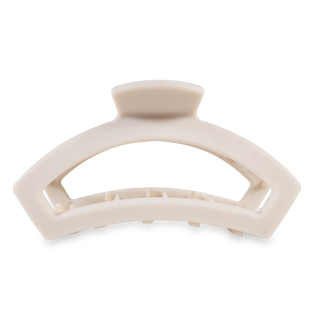 TELETIES open hair clip with curved design and metallic accent strip on white background