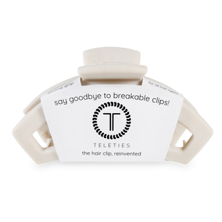 TELETIES hair clips in packaging with "say goodbye to breakable clips" marketing text and brand logo