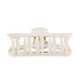 White open hair clip with rectangular teeth design displayed against neutral background