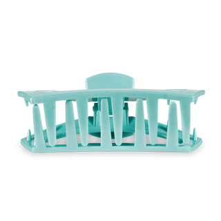 Large turquoise open hair clip with vertical slat design and curved shape