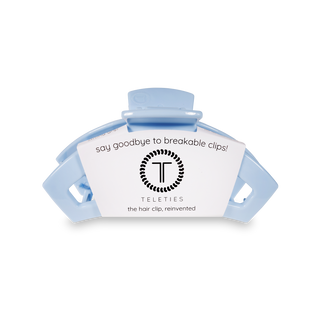 TELETIES open hair clip with product label showing brand logo and "say goodbye to breakable clips" text