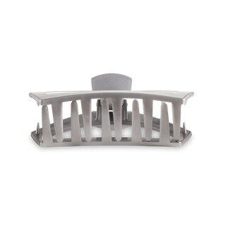 Clear plastic hair clip with vertical slats and curved design on white background