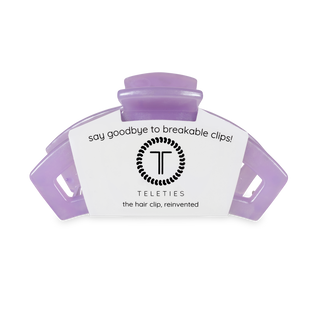 Purple TELETIES hair clip in clear packaging with brand logo and product messaging
