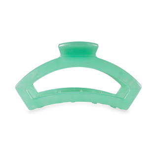 TELETIES open hair clip in translucent green with curved design and spring-loaded mechanism