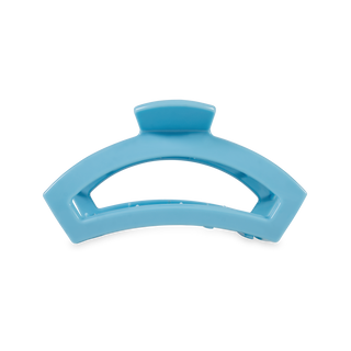Light blue curved hair clip with open design and smooth finish against white background