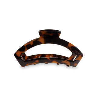 Tortoiseshell hair clip with curved design and secure grip teeth for medium hair styling