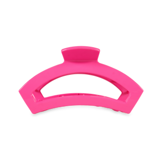 Bright pink curved hair clip with grip teeth and hinged clasp mechanism