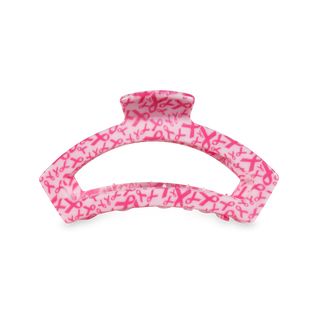Pink patterned medium open hair clip with curved design and textured grip surface