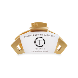 TELETIES open hair clip in gold/champagne color with branded packaging label