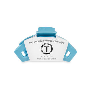 TELETIES open hair clip in blue with product packaging showing "say goodbye to breakable clips" text