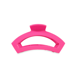 Pink curved hair claw clip with open design and central grip mechanism