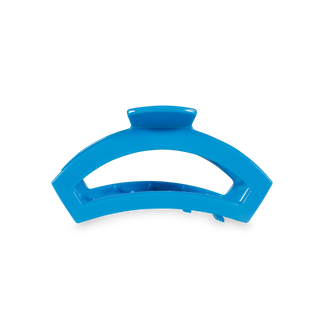 Blue curved open hair clip with transparent accent stripe on white background