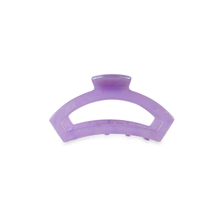 Purple translucent hair clip with curved design and grip teeth for securing hair
