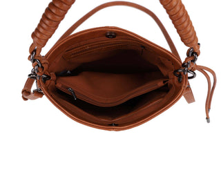 Open brown leather satchel showing interior compartments, pockets, and zipper details with chain hardware.