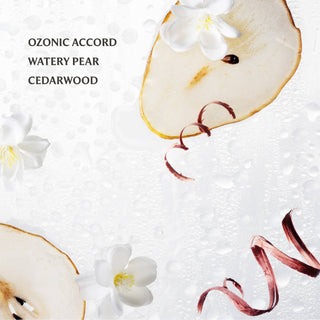 Touchland hand sanitizer with pear slices, white flowers, and red ribbon on white background