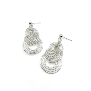 Silver spiral wire earrings with multiple interlocking circular rings and post backs