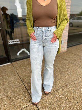 Risen Groovy Girl Flares styled with brown bodysuit and olive cardigan, worn outdoors.