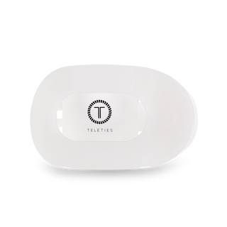 TELETIES round flat hair clip in white displayed in clear plastic packaging against black background