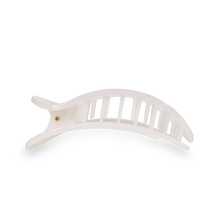 White round flat hair clip with curved design and grip teeth displayed on black and white background