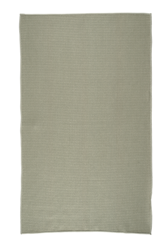 Sage green kitchen towel with textured waffle weave pattern on white background