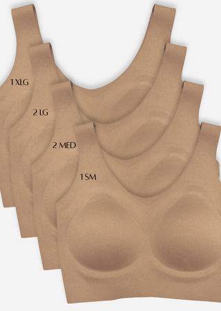 Stack of nude-colored seamless bras in various sizes laid out showing different size options available.