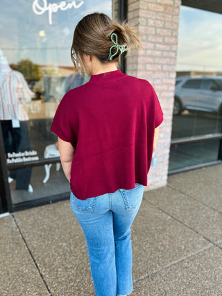 Zenana Short Refined Rib Sweater Top worn by model shown from the back, paired with jeans.