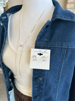Silver Serenity jewelry set displayed on mannequin wearing denim jacket, featuring delicate necklace and stud earrings.