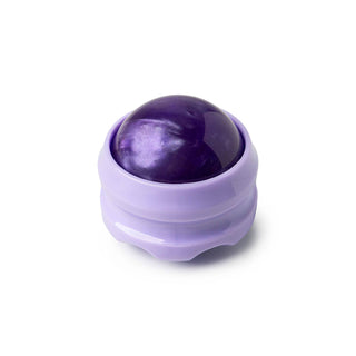 Purple massage ball roller in translucent container for muscle relief and body therapy