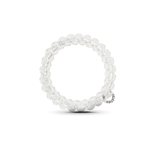 Clear spiral hair coil ties arranged in a circular pattern on white background