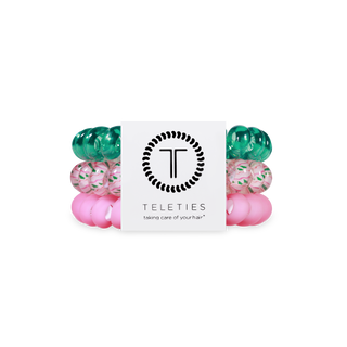 TELETIES spiral hair coils in festive holiday colors including green, pink and patterned designs