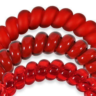 Three red spiral hair coils with glossy finish displayed against transparent background