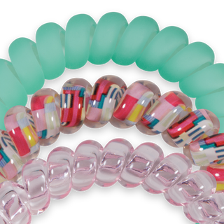 Three spiral hair coils in different colors and patterns including solid, striped, and translucent designs.