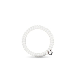 White spiral hair coils arranged in a clear display package with brand logo