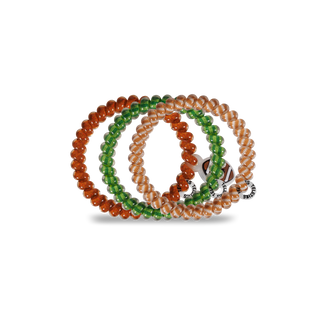 Three spiral hair coil bracelets with football-themed beaded designs and branded charm pendants.