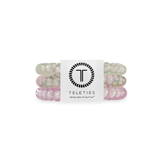 TELETIES spiral hair coils in translucent colors with brand packaging and logo
